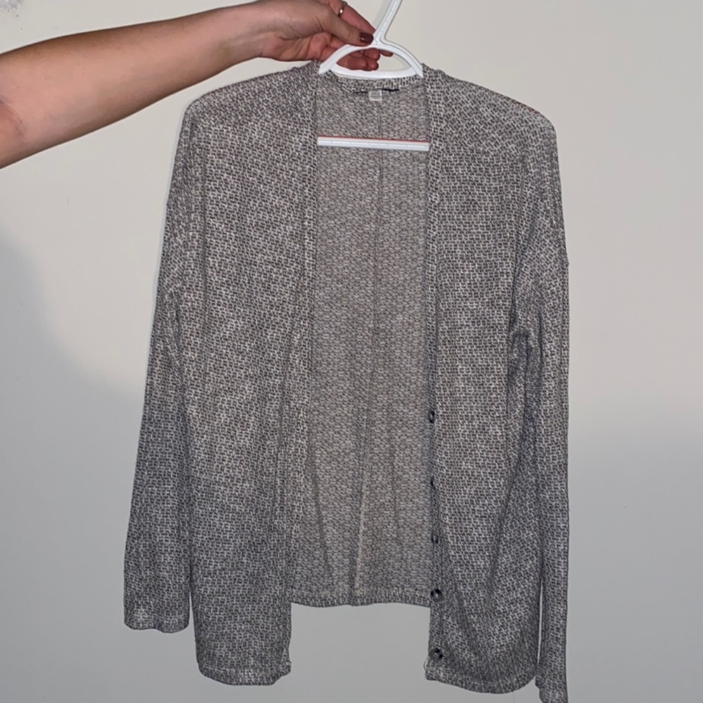 Tan and black cardigan.